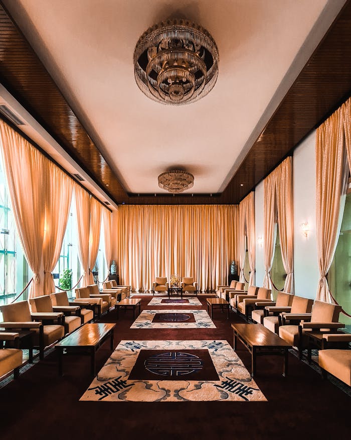 Luxurious hotel lounge interior with elegant furniture and chandeliers creating a sophisticated ambiance.